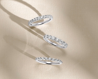 Image of 3 wedding rings on nude background image